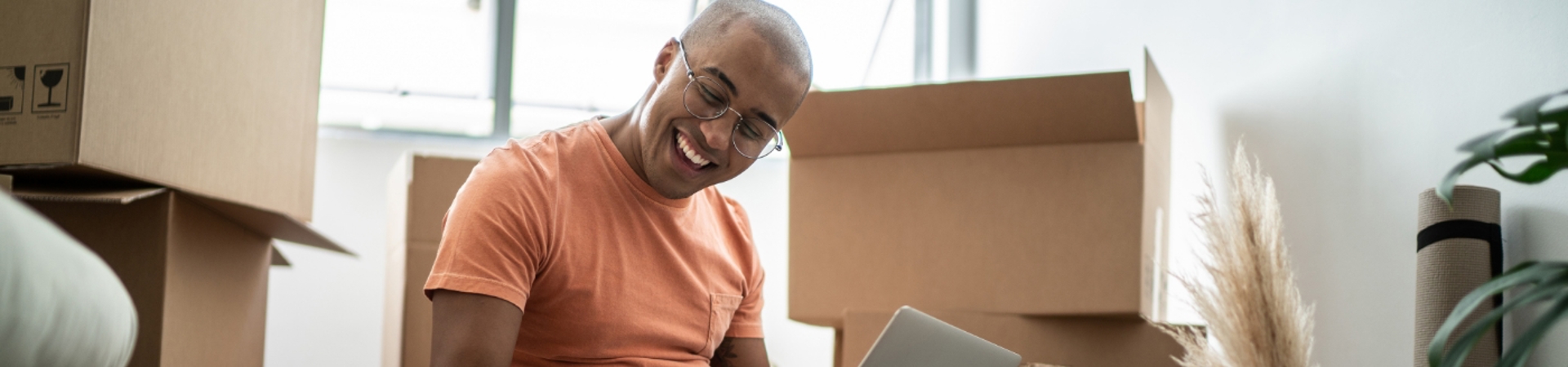 Man sitting on the floor stroking his dog
