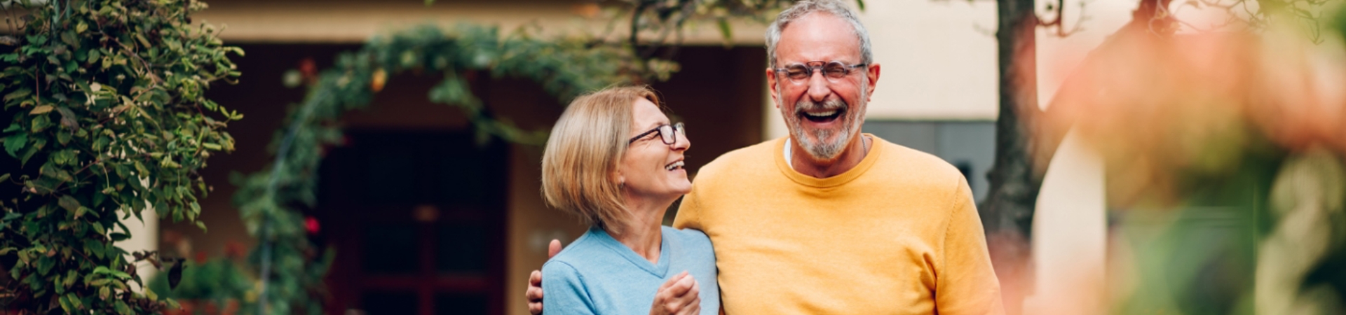 Couple with keys to a new home walking