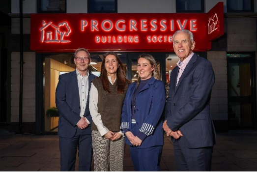 A group of people standing in front of a building
AI-generated content may be incorrect.